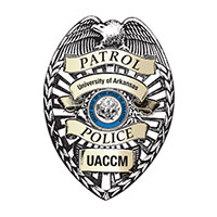 UACCM Campus Police logo featuring a howling wolf inside a sheild shape.