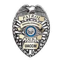 UACCM Campus Police logo featuring a howling wolf inside a sheild shape.