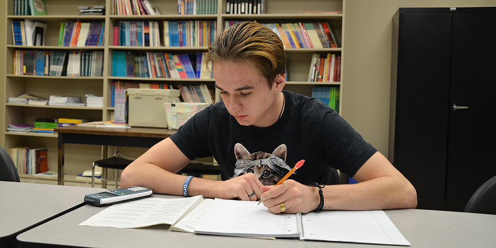 Students in class working on math problems.