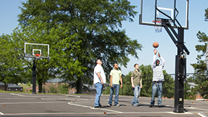 Students playing basketball on the basketball court.