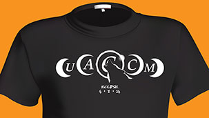 Black shirt featuring five phases of the sun in and out of the eclipse with a wolf howling in the center.