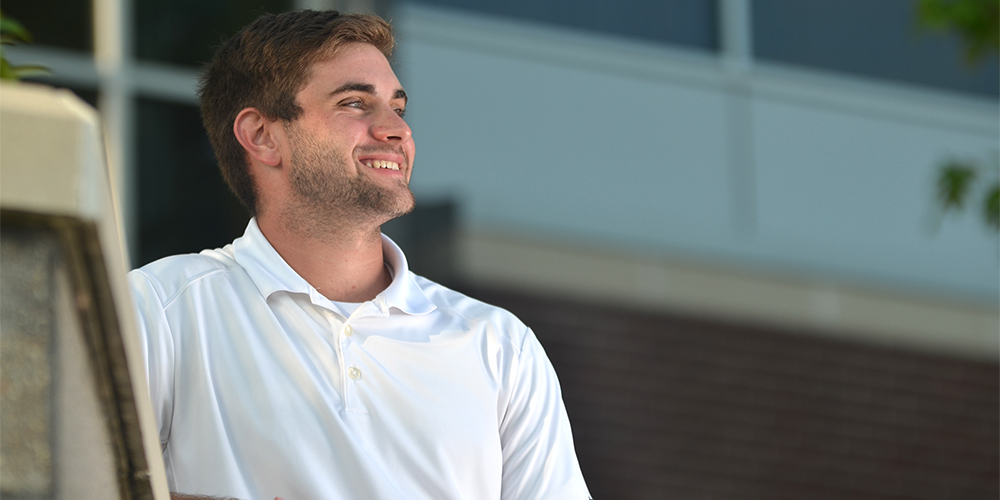 Smiling student looking up.
